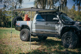 Rooftop awning attached to roof rails on a Toyota Tacoma truck