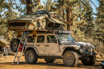 Vagabond XL Rooftop Tent in Forest Green Hyper Orange with telescopic ladder on a Jeep Rubicon