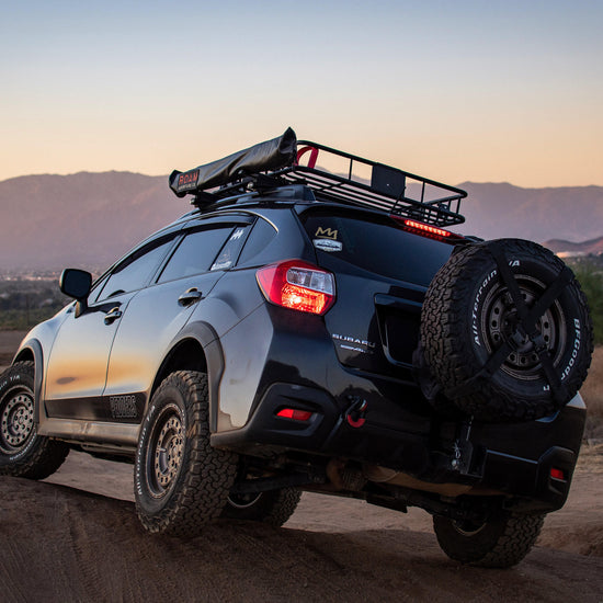 Rooftop awning attached to roof rails of a Subaru Crosstrek