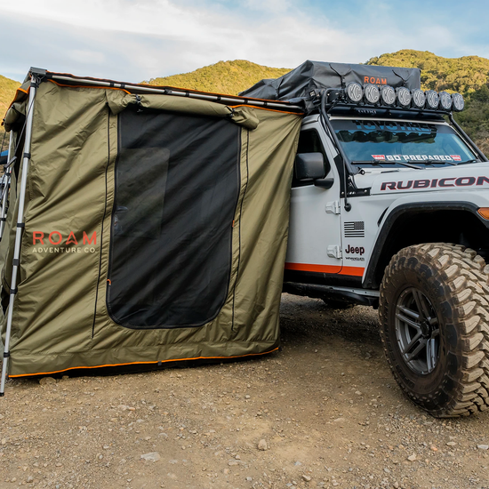 ROAM Adventure Co. Rooftop Awning Room in Forest Green shown on a Jeep Rubicon